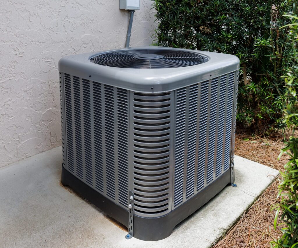Modern,Hvac,Air,Conditioner,Unit,On,Concrete,Slab,Outside,Of
